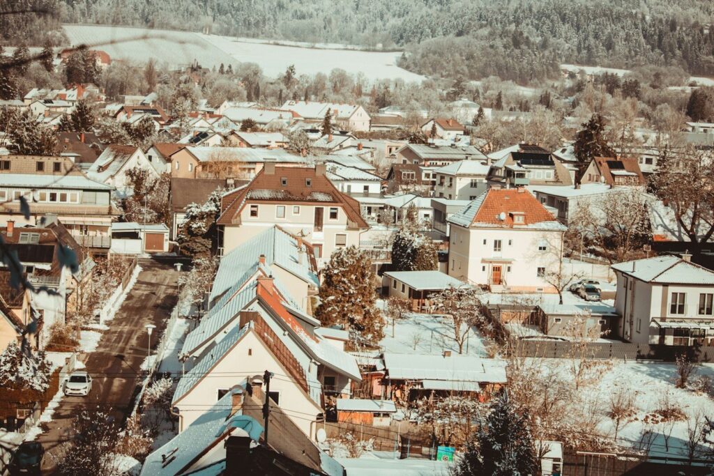 a view of a town with snow on the ground